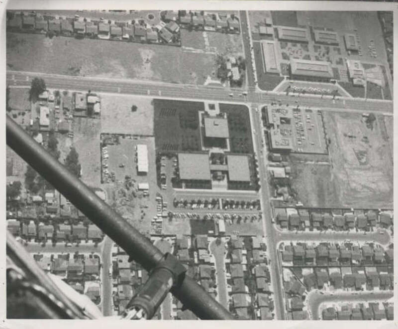 Aerial view of Cypress Civic Center (lower left quadrant) and Oxford Junior High School (upper right), before the construction of the Cypress Library (left of the civic center). The intersection shown is Orange Avenue (W/E) at Grindlay (N/S) This
