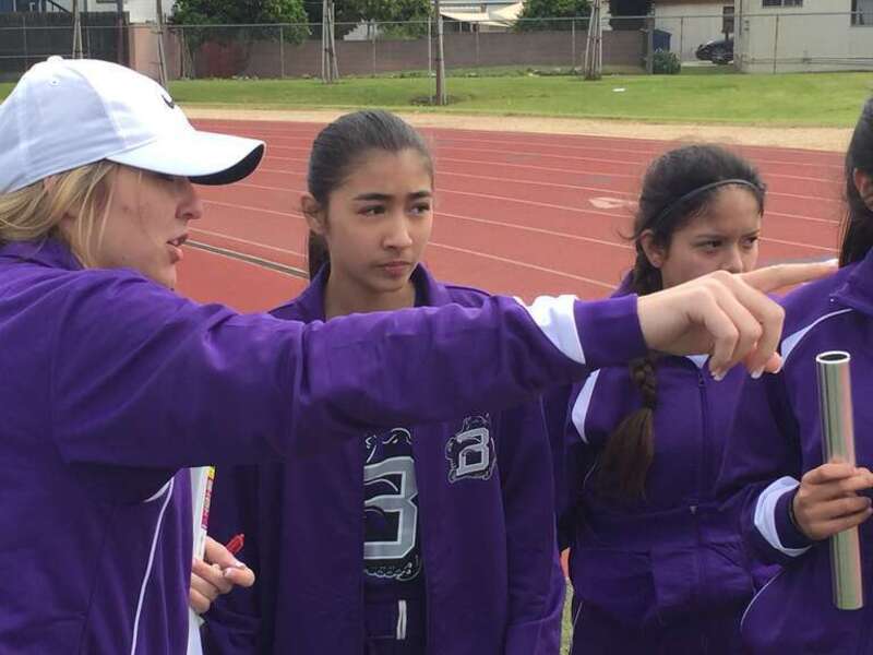 Brooklin Brumund, BHS Athletic Director, with Track &amp; Field Athletes