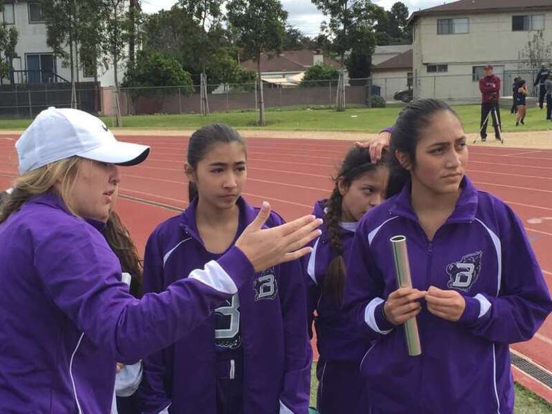 Athletic Director Brooklin Brumund with track &amp; field athletes