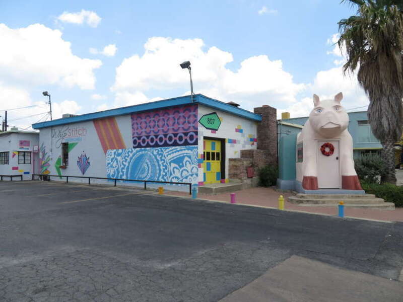 Pig building located on South Saint Marys Street near the intersection with Pereida Street next to the building at 807 South Presa Street, San Antonio, Texas.