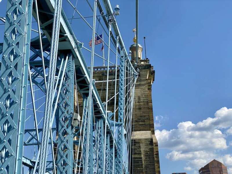 The John A. Roebling Suspension Bridge spans the Ohio River, and connects the cities of Covington, Kentucky and Cincinnati, Ohio. Begun in 1856, it was designed and built by famed engineer John A. Roebling, whom went on to design the more famous