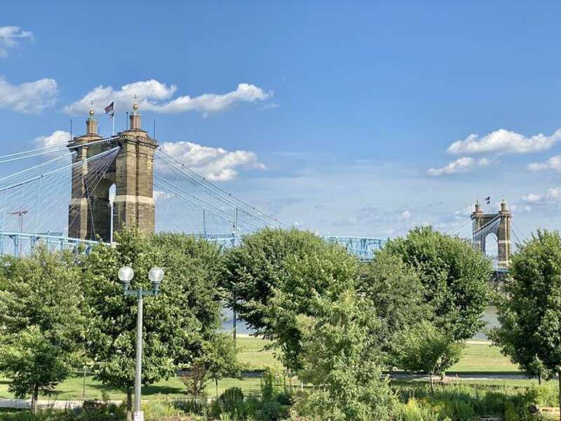 The John A. Roebling Suspension Bridge spans the Ohio River, and connects the cities of Covington, Kentucky and Cincinnati, Ohio. Begun in 1856, it was designed and built by famed engineer John A. Roebling, whom went on to design the more famous