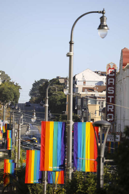 LGBT pride flags in San Francisco's Castro District, with the Castro Theatre on the right