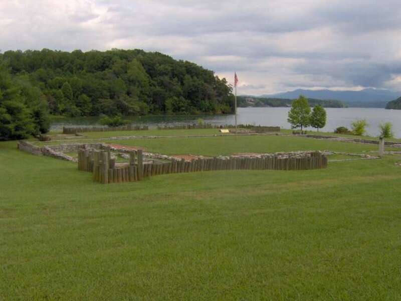 The Tellico Blockhouse site, with foundations and posts marking the original outline of the fort.  The blockhouse was situated at the confluence of Nine Mile Creek (left) and the Little Tennessee River (right).  The Unicoi Mountains rise in the