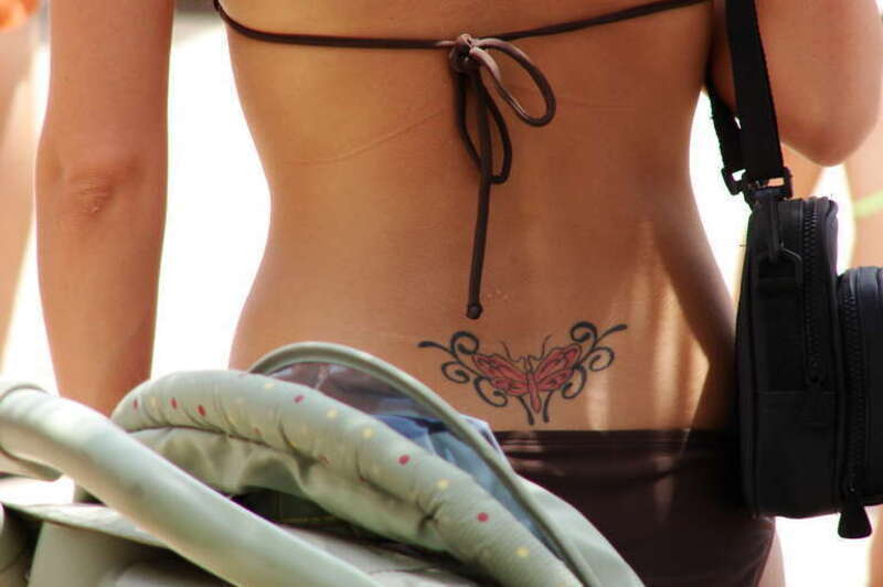 Lower back tattoo ("tramp stamp").