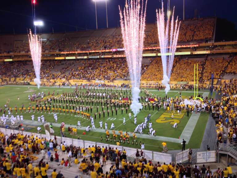 ASU football team takes the field in the opening game of the 2013 season.