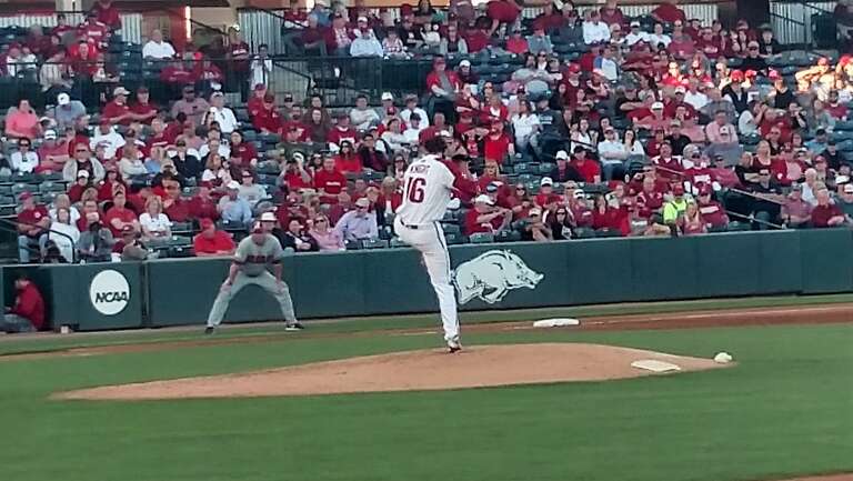 Blaine Knight pitches for the Arkansas Razorbacks against the Alabama Crimson Tide at Baum Stadium in 2018