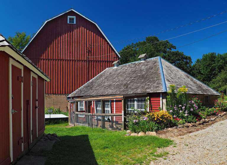 Holz Farm, 4665 Manor Dr, Eagan, Minnesota, USA.  Contributing properties left to right are the milk &amp; pump house, stock tank, barn, and chicken coop, viewed from the east.