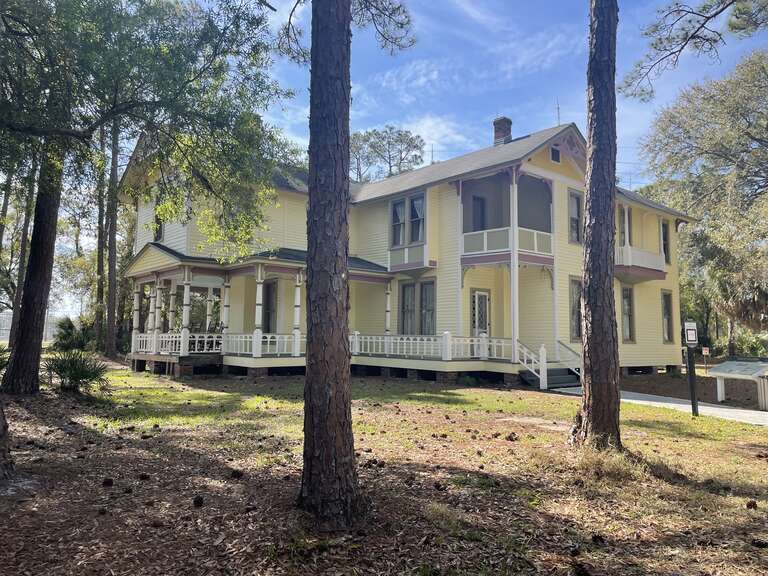 This impressive home is part of Pinellas County's history. It is a historic home that features a classic Queen Anne style through its asymmetrical shape, wings, and gables facing in multiple directions. The home was originally built in 1907 and moved