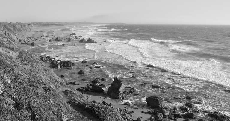 Waves piling up as they approach the shore, along CA Route 1.  The road follows this spectacular coastline for miles.