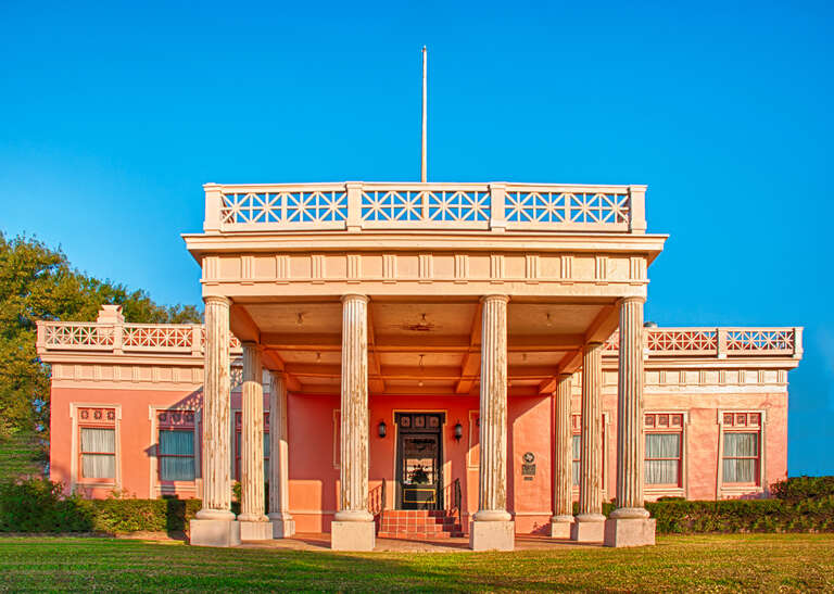 Pompeiian Villa The Pompeiian Villa, nestled right beside the seawall in downtown Port Arthur shines brightly in the morning sun.