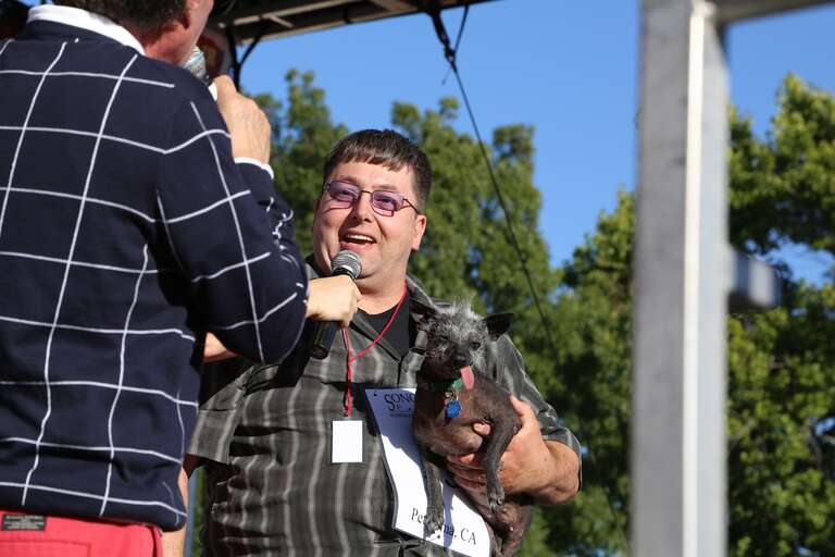 This guy loved his ugly dog, lolling tongue and all.  I liked it that you could see it in his face.  And the dog trusted him to do the right thing. (At the World's Ugliest Dog Contest.)