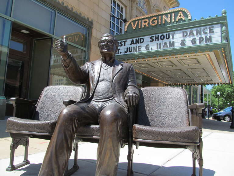 A statue of film critic Roger Ebert giving his trademark "thumbs up" gesture outside the Virginia Theater in Champaign, IL