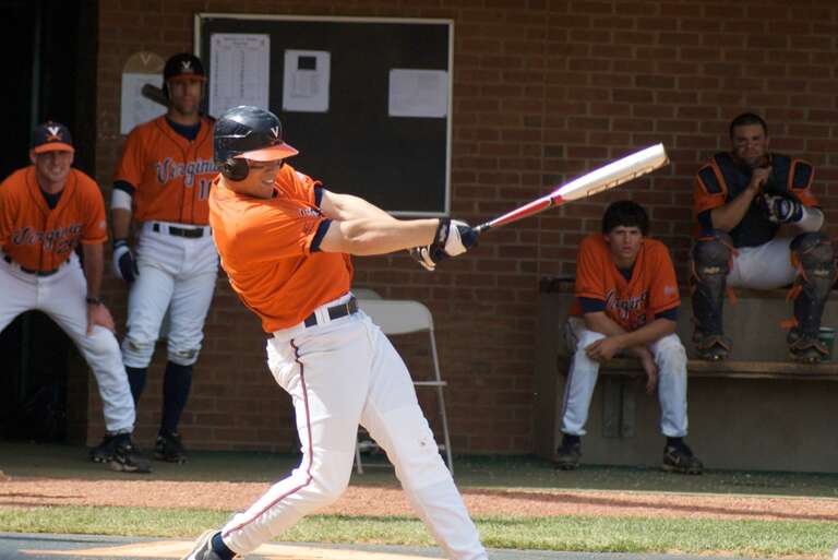 A Virginia Cavaliers baseball player swings at a pitch during a 2009 game