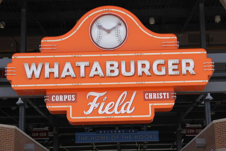 Whataburger Field sign located in Corpus Christi, TX; at the bottom, it reads "Welcome to the Home of the Hooks"
