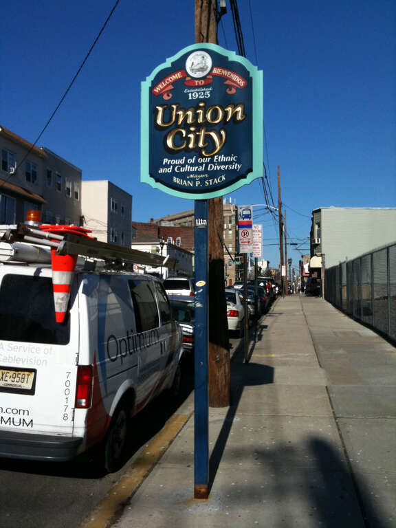 Sign in Union City, New Jersey, at its southern border with Jersey City on Summit Avenue, two blocks south of Transfer Station. Photo by Luigi Novi. This photo may be used for any purpose, provided that the photographer is visibly credited in each