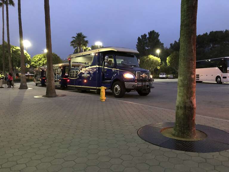 A front-right view of a 2002-present Freightliner Business Class M2. This particular model is being used as a shuttle, transporting guests to and from Universal Studios Hollywood. In addition, a unique Universal Studios logo is present on the grille.