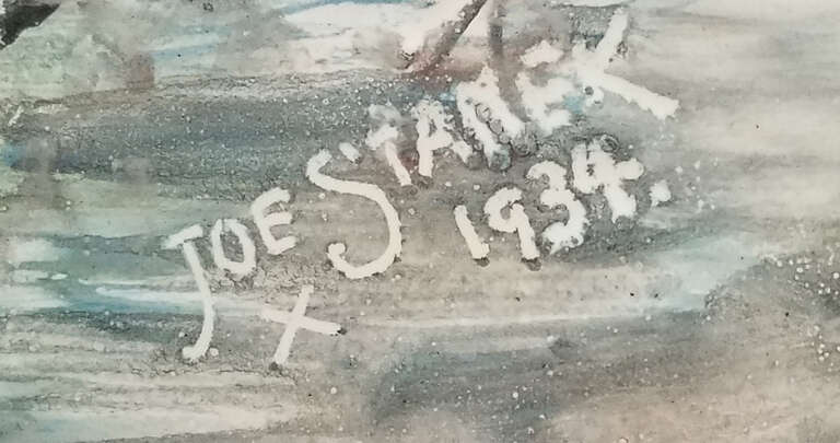 Porcelain enamel on steel painting detail focused on inscription by artist Joseph Stanek, Sr.,