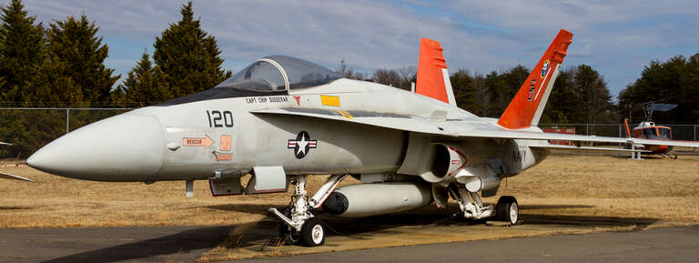 A McDonnell Douglas F/A-18A Hornet on display at the Patuxent River Naval Air Museum. This aircraft, Bureau Number 161353, was received by the Navy in June 1981, and was first a part of the VFA-125 training squadron.  It was transferred to the Naval