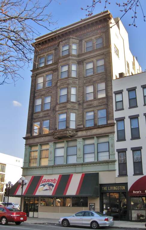 The Livingston Building in the Bloomington Central Business District (c. 1903). It was the first steel-framed skyscraper in downstate Illinois. It was the home of the Livingston &amp; Sons department store for over a decade.  It housed a Walgreens