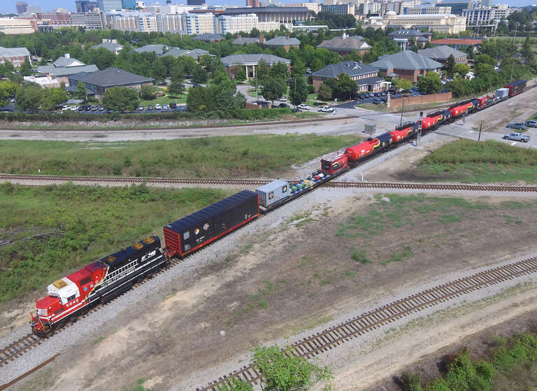 A shot of the whole NS 975 as they enter Devine Junction to back into NS Andrews Yard.