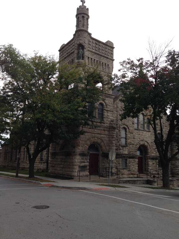 Photograph of Sacred Heart Catholic Church at the corner of Madison and 26th streets, Kansas City, Missouri.