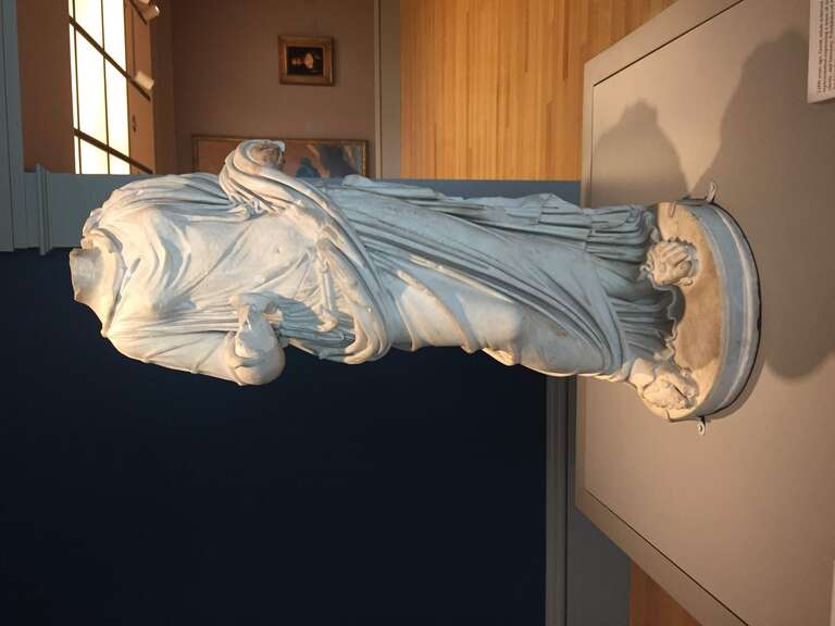 A statuette of Salus (c. 69-192 A.D.; Roman Imperial Period) by an anonymous sculptor; marble. Located in the Columbia Museum of Art (Columbia, South Carolina).
