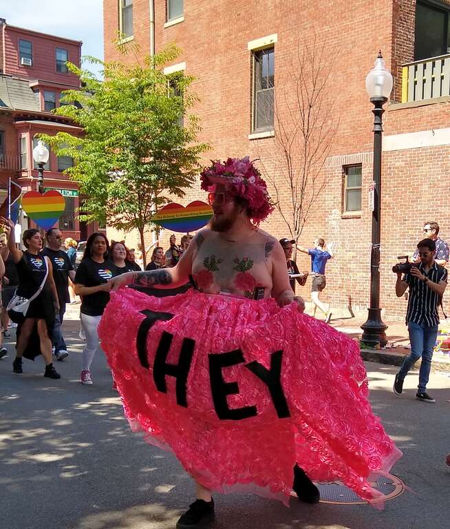 Proponent of pronoun "they" representing someone who doesn’t identify with either gender at the Boston Pride parade.