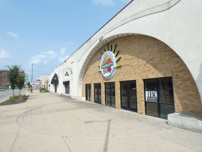 Photo showing the Erie Street Market and other buildings along this street.