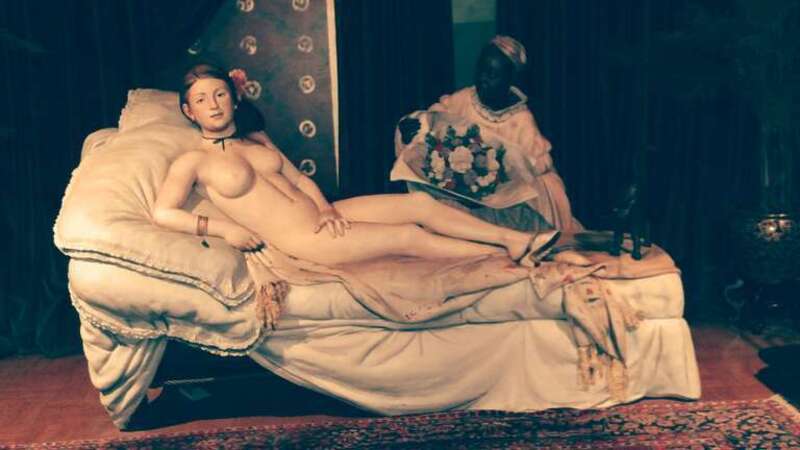 This is Seward Johnson's full-size reconstruction of Edouard Manet's painting "Olympia", which is in the Musee d'Orsay. It is most striking -- one steps through a door into a full-size bedroom, with the prostitute Olympia and her servant (and cat)