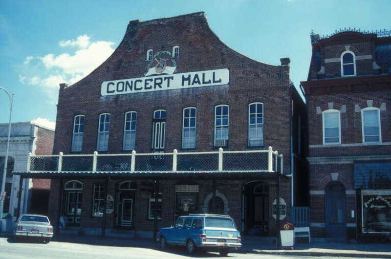 CONCERT HALL; BUILT IN 1878 BY JOHN PFAUTSCH AND PHILLIP KUHN. A TAVERN AND RESTAURANT OCCUPIED THE FIRST FLOOR; A CONCERT HALL WAS ON THE SECOND FLOOR. IT WAS SAID THAT THE SALOON WAS “ONE OF THE LARGEST AND FINEST WEST OF ST. LOUIS." IN ITS HEYDAY,