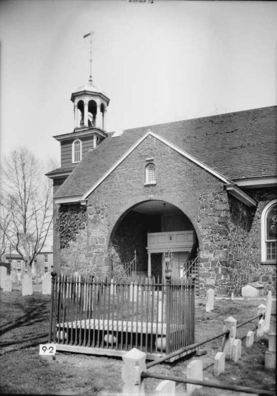 Old Swedes Church (officially Holy Trinity Church) in Wilmington, DE.  SOUTH PORCH. 
Built 1698 — On NRHP.
Image courtesy of the Historic American Building Survey—HABS archives - (1934).HABS DEL,2-WILM,1-16.
