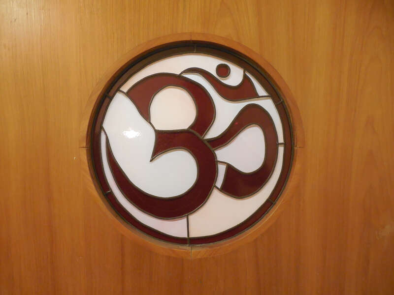 Om symbol on the Main Hall doorway, Kripalu Center for Yoga &amp; Health, Stockbridge, MA, 2014.  For the Kripalu Center's description of the meaning of the symbol, read Valerie Reiss's article at: https://kripalu.org/article/1510/