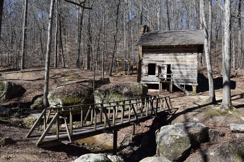 Footbridge and Pioneer Cabin in Tishomingo State Park, Mississippi