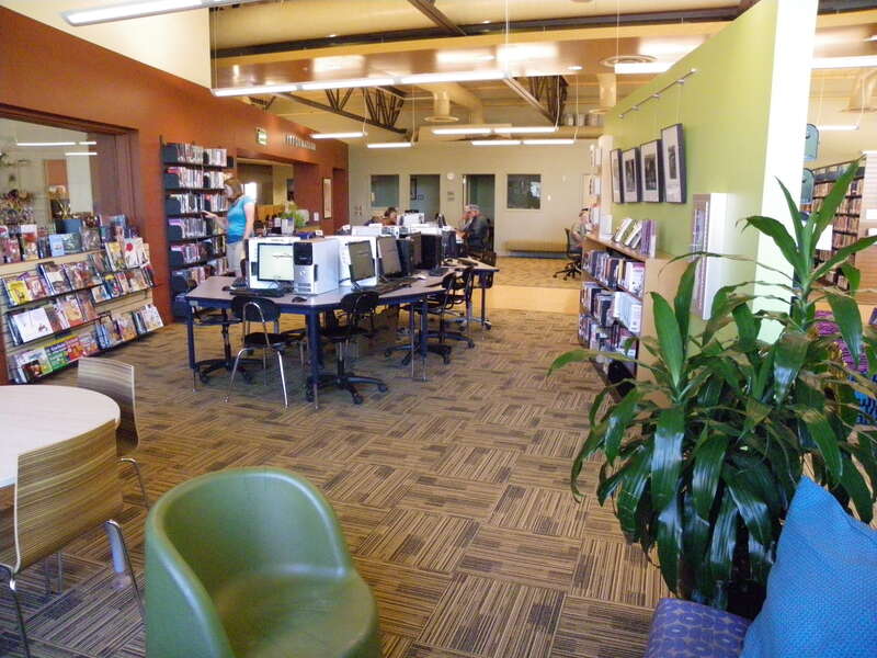 Interior of Grand Country Public Library, Moab showing people using public computers and the library space