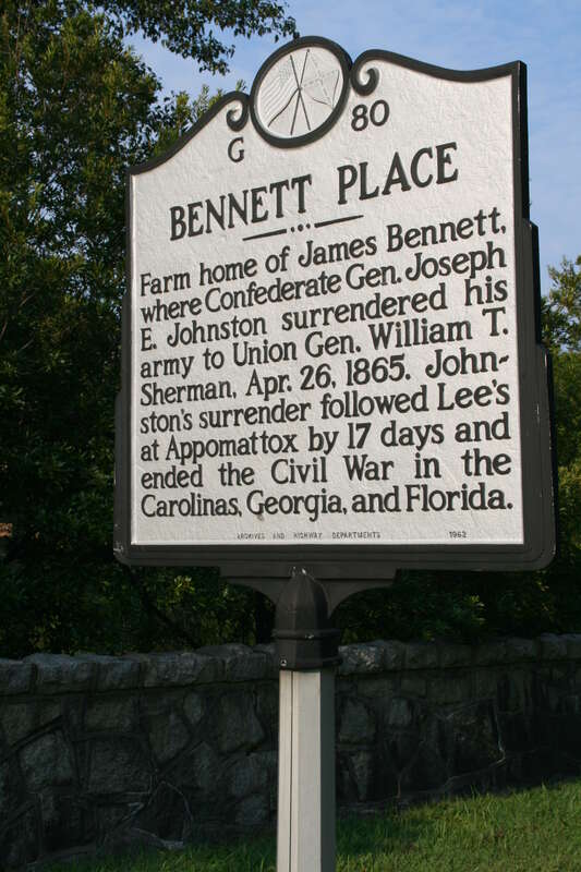 Sign describing Bennett Place in Durham, North Carolina.  The signs reads: "Bennett Place -- Farm home of James Bennett, where Confederate Gen. Joseph E. Johnston surrendered his army to Union Gen. William T. Sherman, Apr. 26, 1865.  Johnston's
