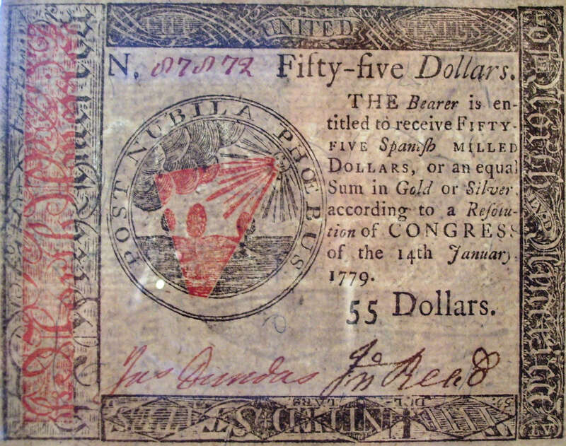 The front (or obverse or face) of a 1779 fifty-five dollar bill of Continental currency. On the other side of the bill is a nature print that was developed by Benjamin Franklin for use on Pennsylvania currency in the decades before the American