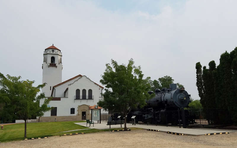 A view of Boise Depot and "Big Mike," an MK-9 Heavy class, type 2-8-2 Mikado built in 1920 by the American Locomotive Company.