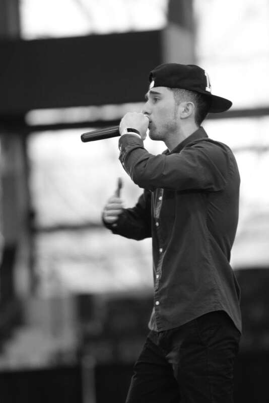 This art work represents American rapper Grisha Consta. He was performing four songs from his LP "IMMIGRANT" at Dorton Arena Raleigh, North Carolina. They are: Nation Of Immigrants, Best Time, My Real Homiez, Dear Mama.