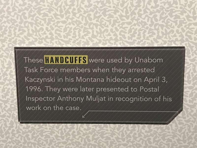 Museum label for the handcuffs used to arrest Ted Kaczynski—the Unabomber—in 1996, on display at the National Postal Museum in Washington, D.C.