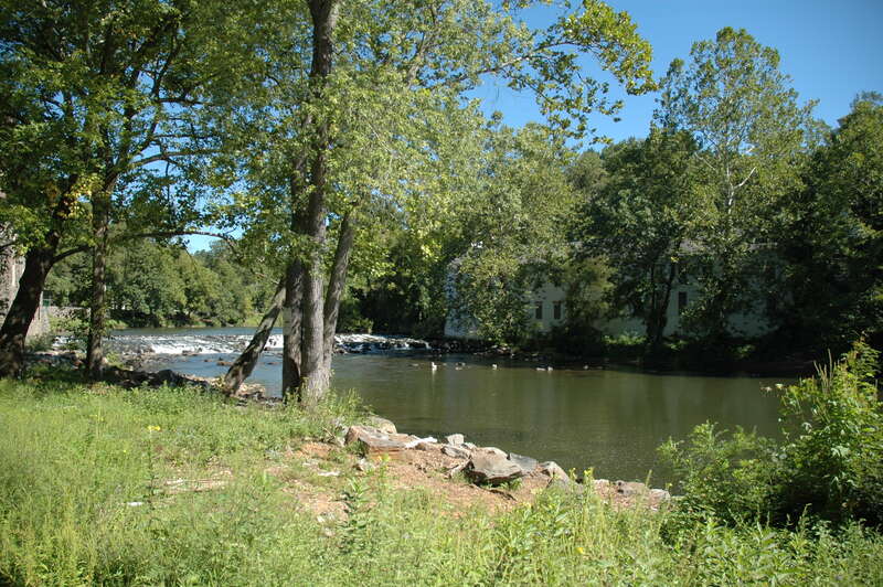 View of the Brandywine Creek at the Breck's Mill Dam. Walker's Mill is the white structure across the creek; Breck's Mill can be seen at the left edge.