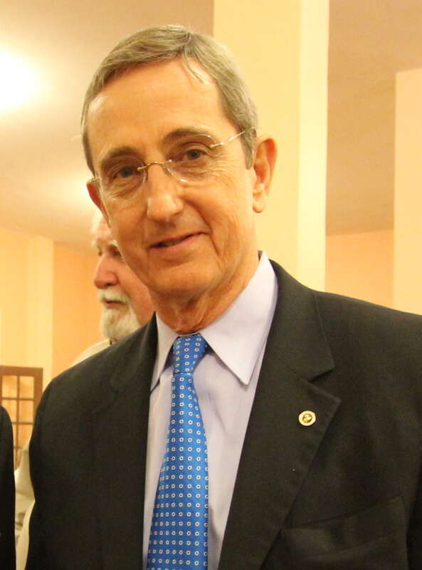 Here TSLAC Interim Director and Librarian Edward Seidenberg (left) shakes hands with Texas General Land Office Commissioner Jerry Patterson (right) at a private reception after the ceremony.