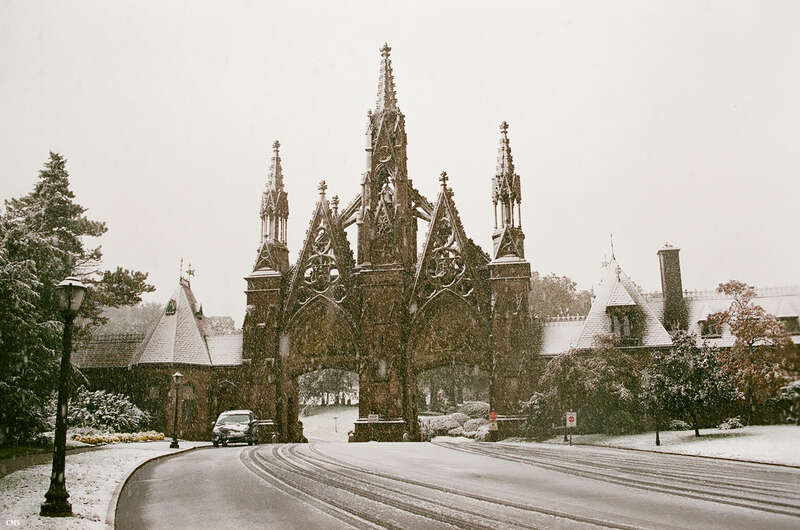 Taken in Brooklyn, New York in October during a sudden snow burst. This is the entrance to Green Wood Cemetery
