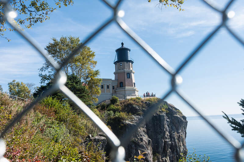 Split Rock Lighthouse, as seen through a fence