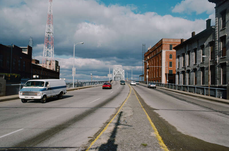 Looking N from median of Kentucky approach to Clark (2nd St.) Bridge, just N of Main St..
At left, LG&amp;E Waterside Station .
Brick building at right is Belknap warehouse being converted to offices for Presbyterian HQ.
Louisville, Kentucky.
Dec.