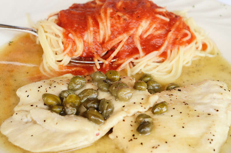 Chicken piccata with capers &amp; white wine with capellini &amp; tomato sauce at Bongiorno Italian Restaurant in Mountain Brook, Alabama. Had it for lunch today.