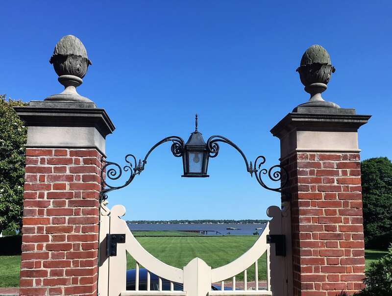 view of the Delaware River from the main gate of George Read House garden, New Castle, Delaware.