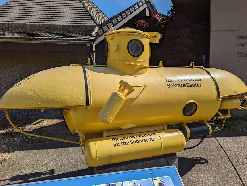 An image of the "Newmas" two-man yellow submarine, located on display outside Oregon State University's Hatfield Marine Science Center in Newport, OR.