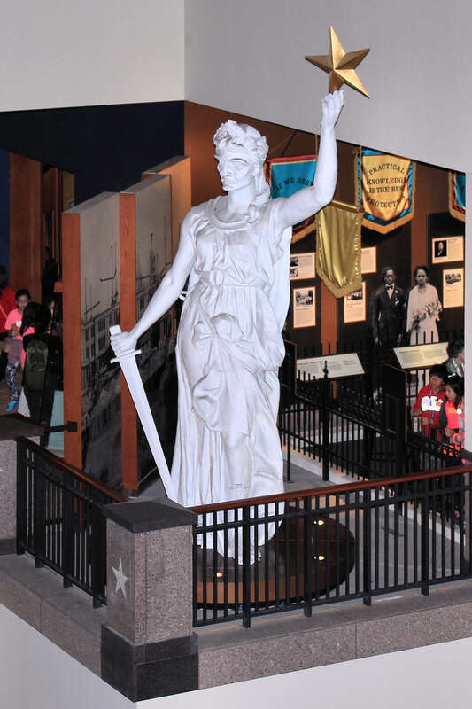 The original Goddess of Liberty statue was placed on the top of the Texas State Capitol dome in 1888. The original statue was cast in zinc and painted white. In 1986, a replica of the statue made of aluminum replaced the original, which had