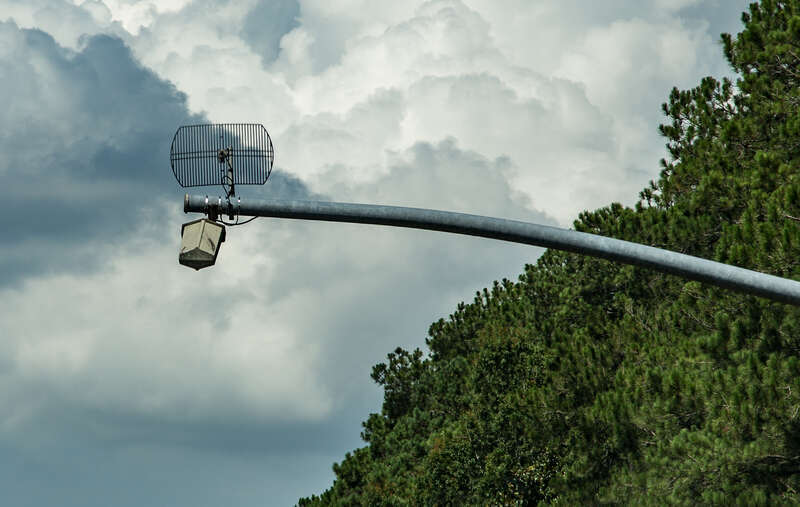 A PrePass transponder reader and antenna over Interstate 10 near Pearlington, Mississippi. For commercial vehicles and trucks to bypass weigh stations.